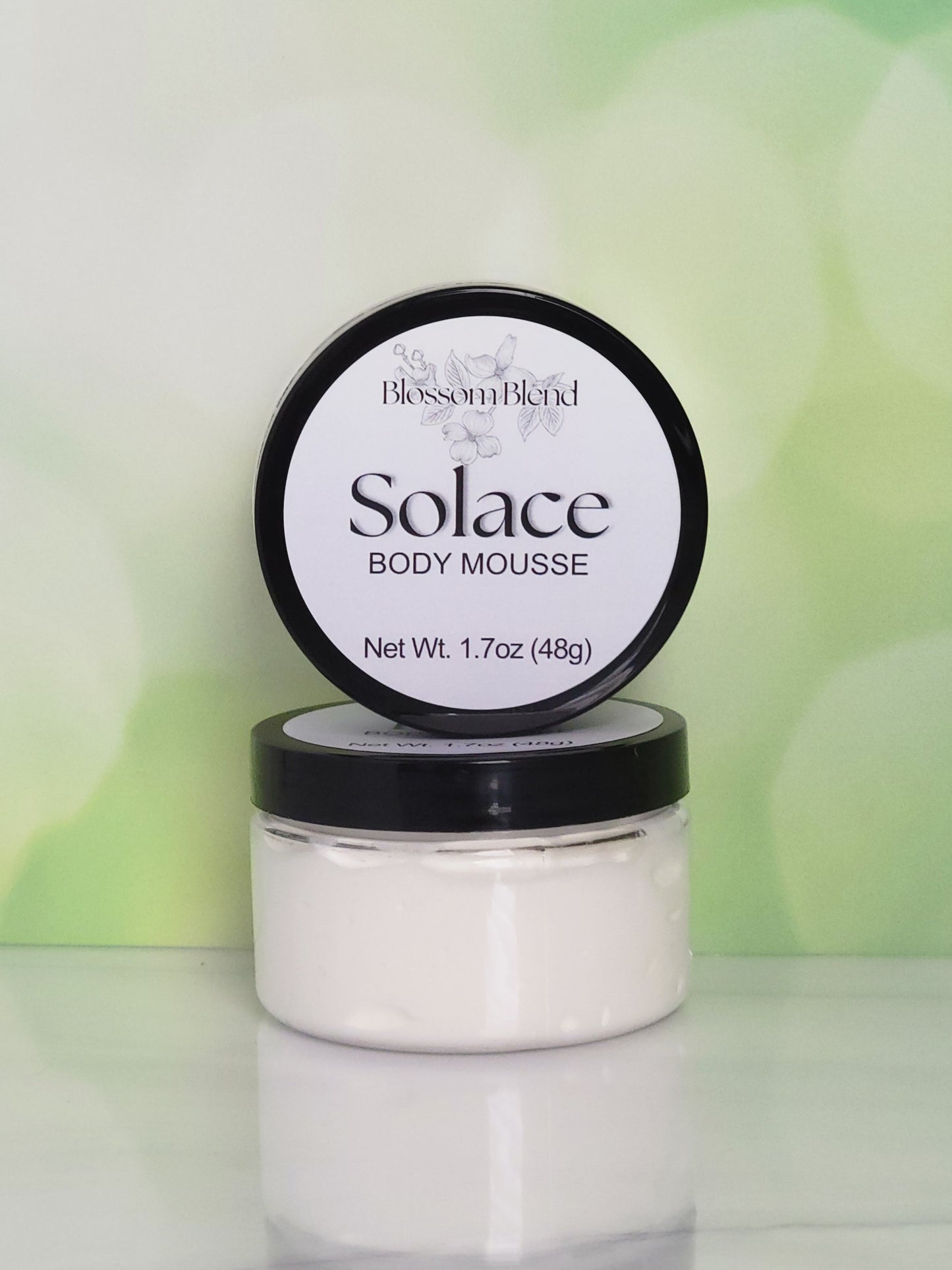 Blossom Blend Solace Body Mousse jar with lid on a white background