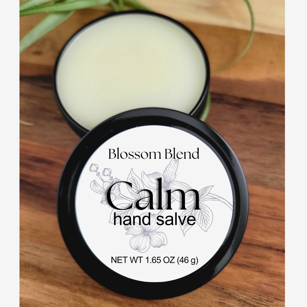 Blossom Blend Calm hand salve container on a wooden surface
