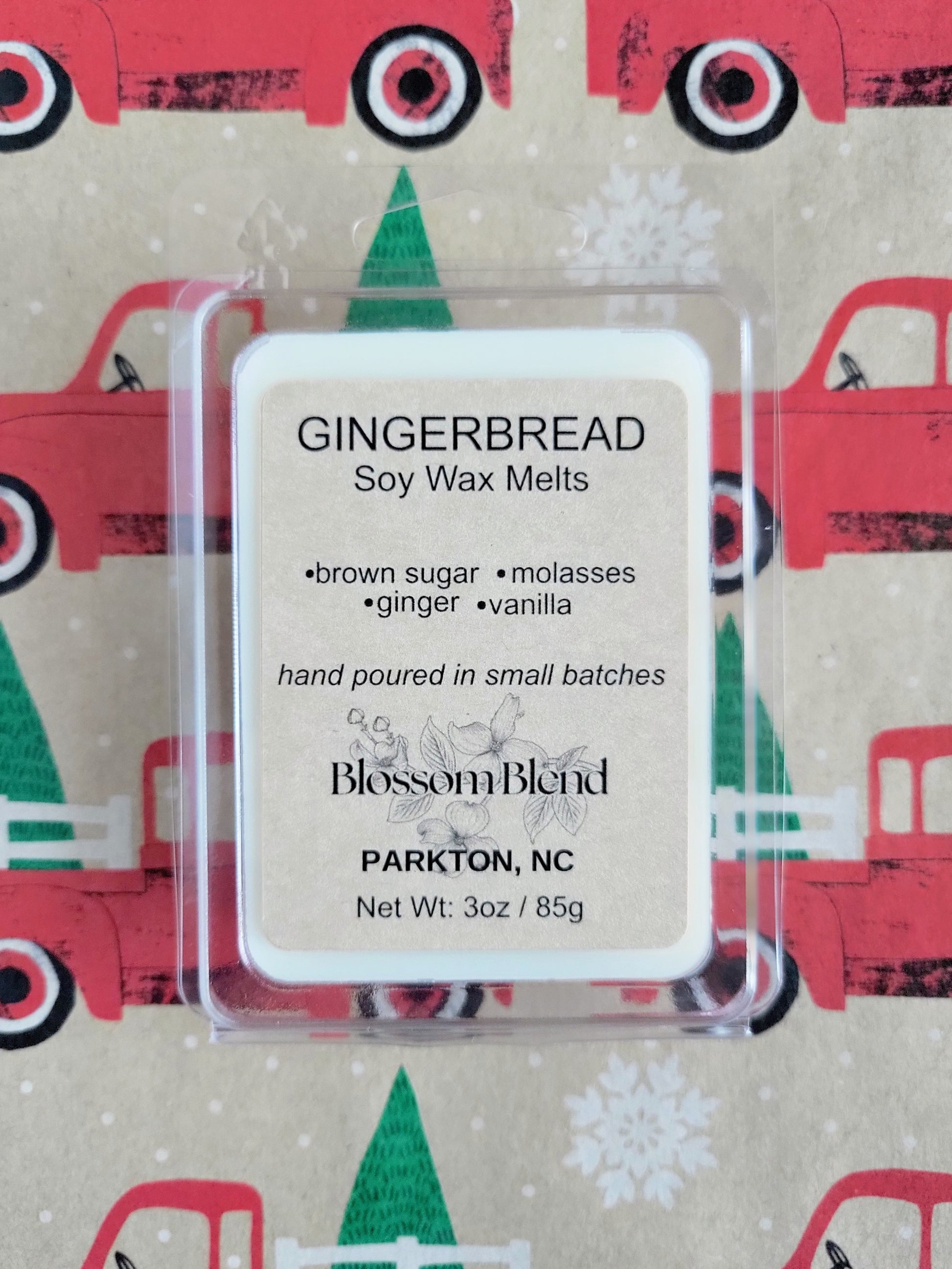 Gingerbread soy wax melt package with a festive background