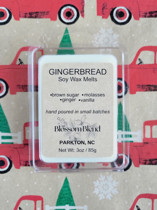 Gingerbread soy wax melt package with a festive background