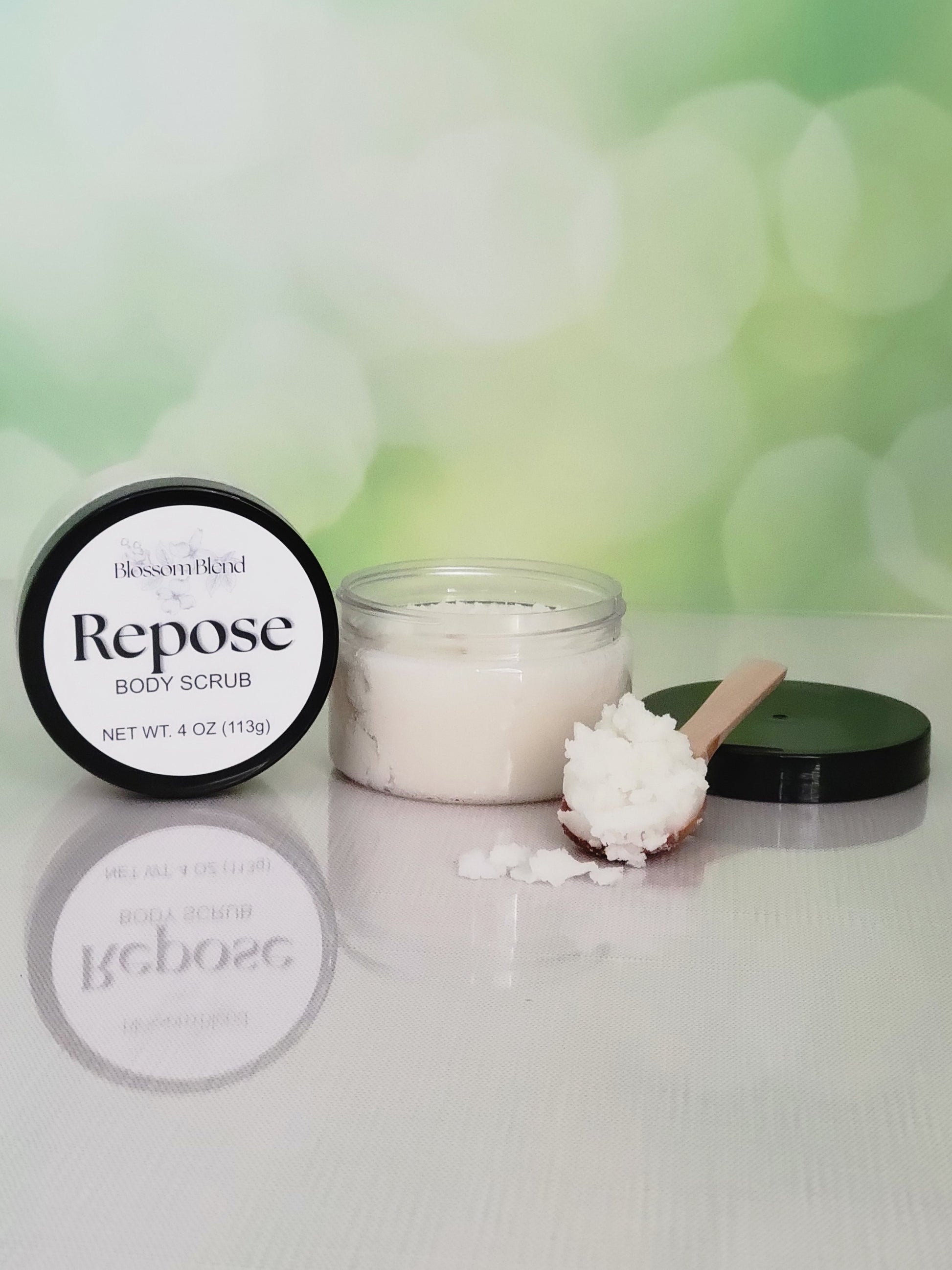 Repose body scrub with packaging on a white surface