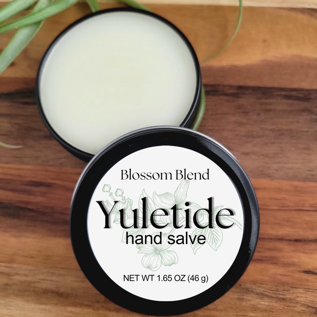 Yuletide hand salve container with label on a wooden surface